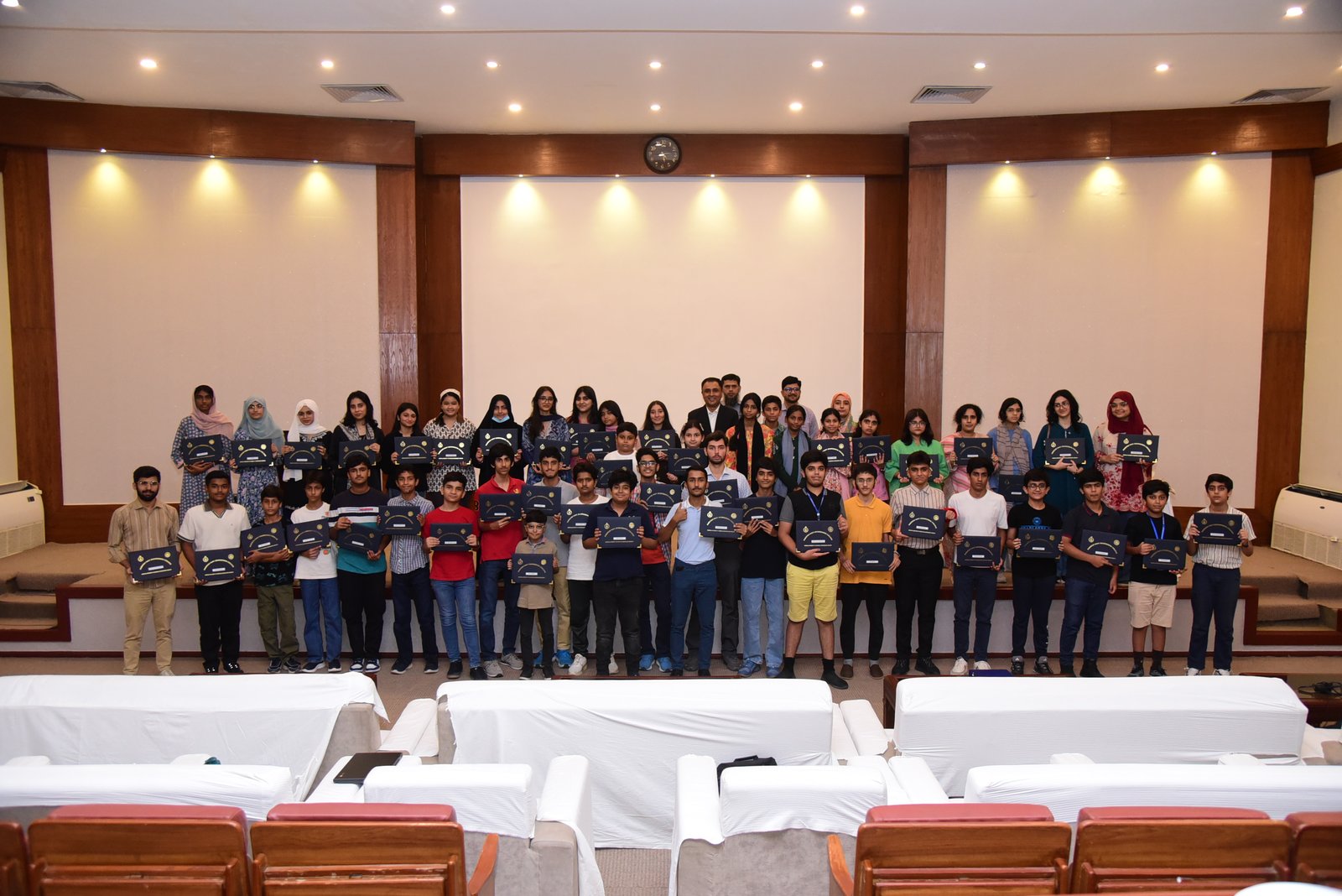 Students receiving certificates after a Quantify STEM session